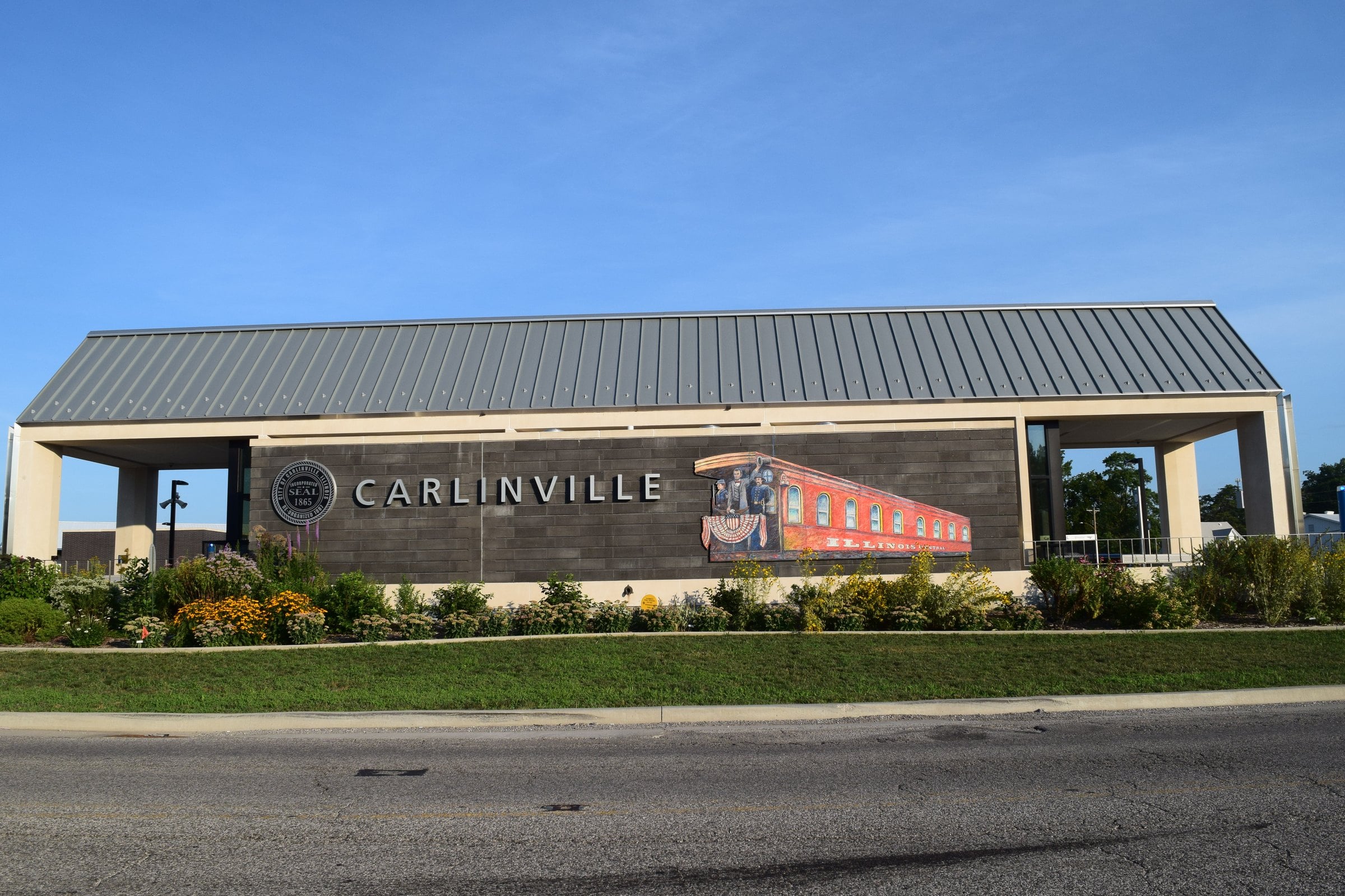The renovated Carlinville, Illinois, passenger rail station under a blue sky