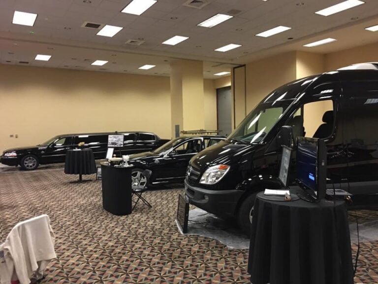 Executive Transportation vehicles displayed at an indoor event