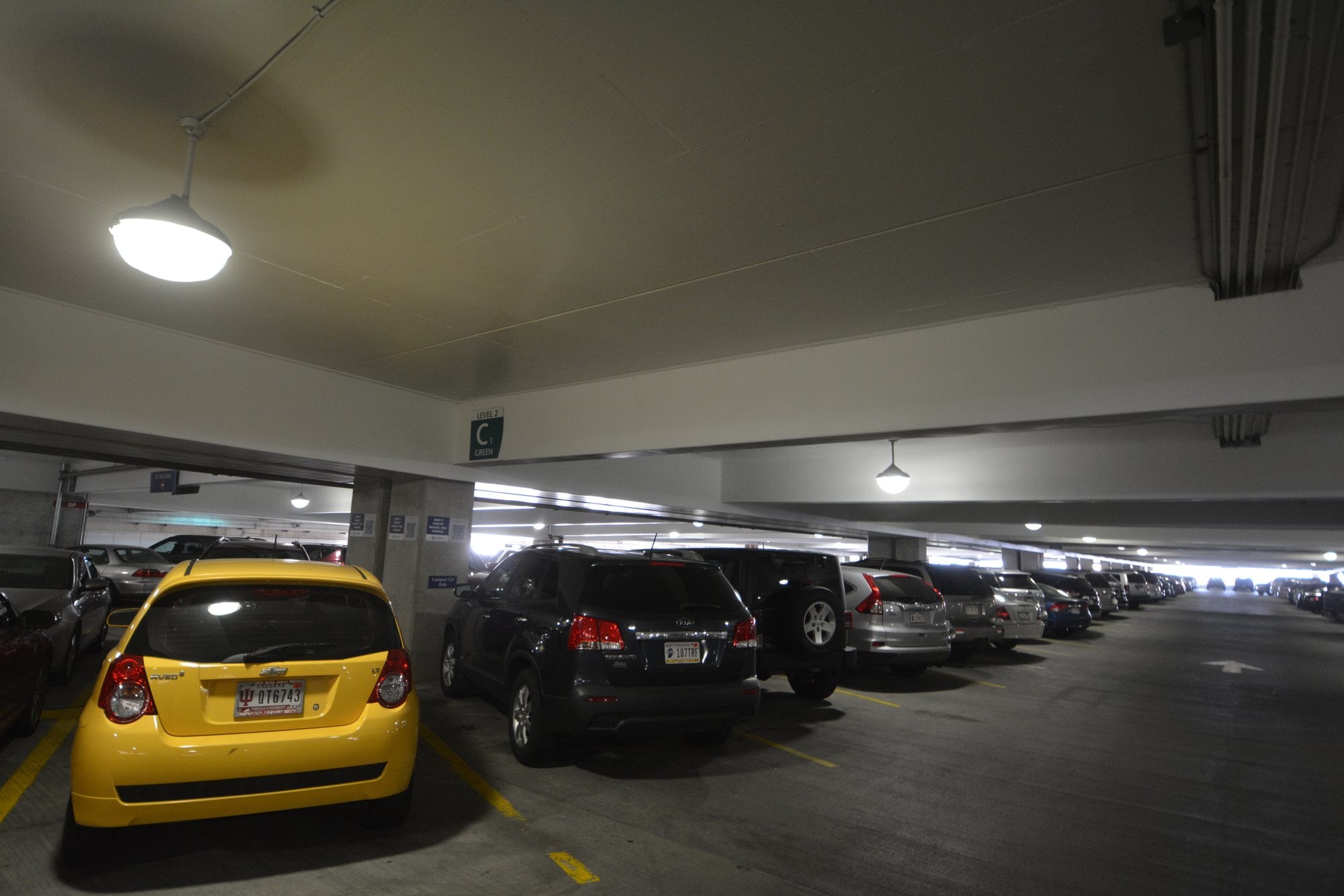 Rows of cars parked on a covered deck of the parking garage at Indianapolis International Airport