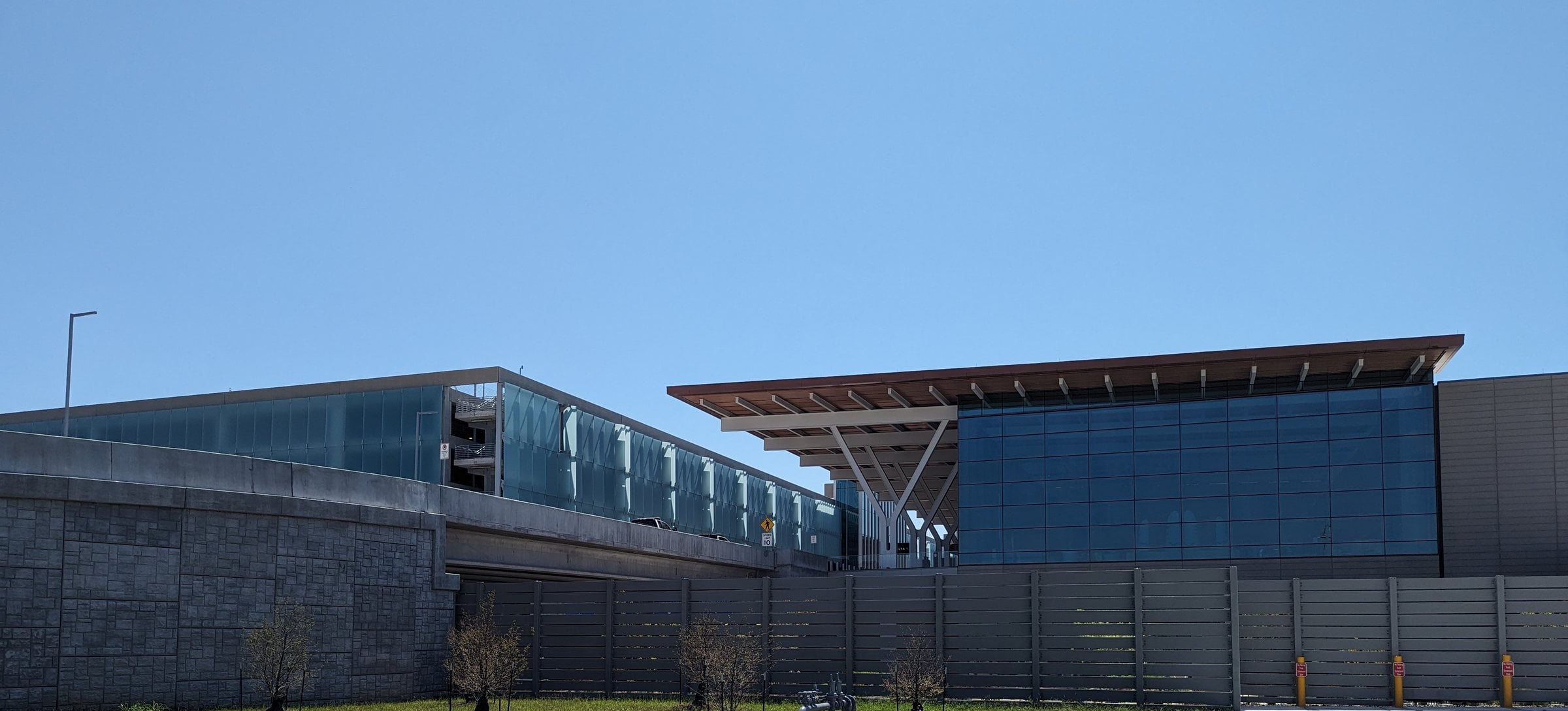 The glass and timber frontage of the single new passenger terminal at Kansas City International Airport