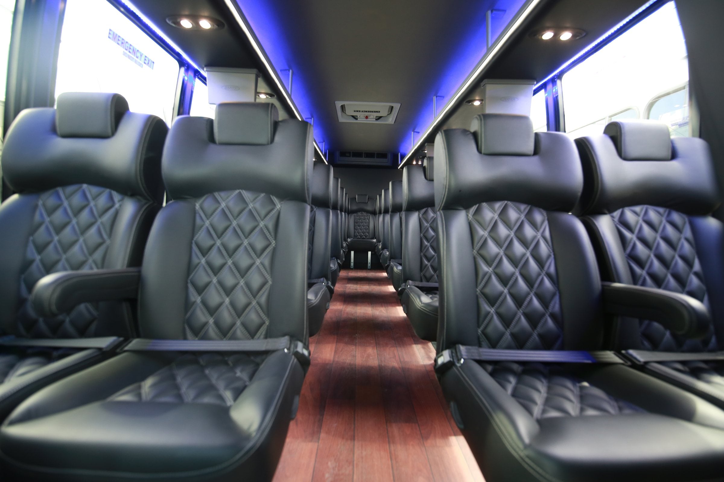 Diamond-stitched leather seats inside a luxury coach
