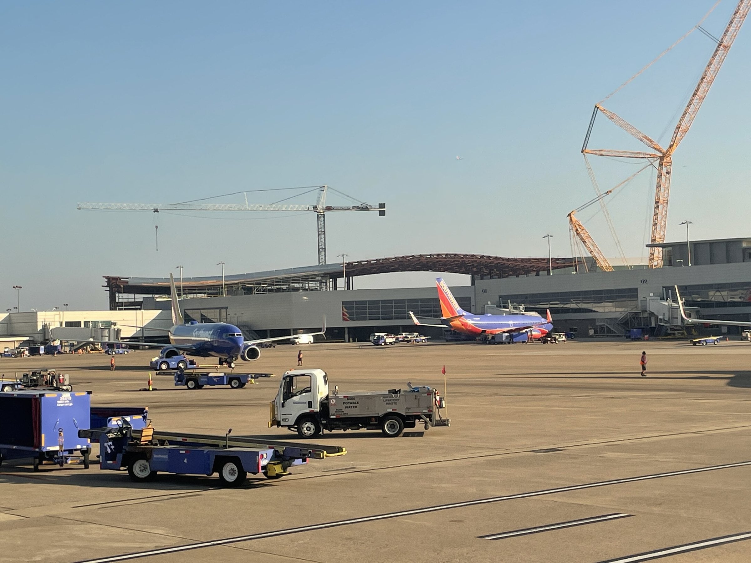 Airliners parked at the gates at Nashville International Airport with the terminal canopy behind them