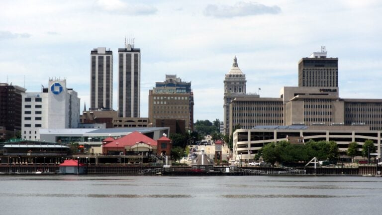 The downtown Peoria, Illinois skyline rises along the riverfront across the Illinois River.