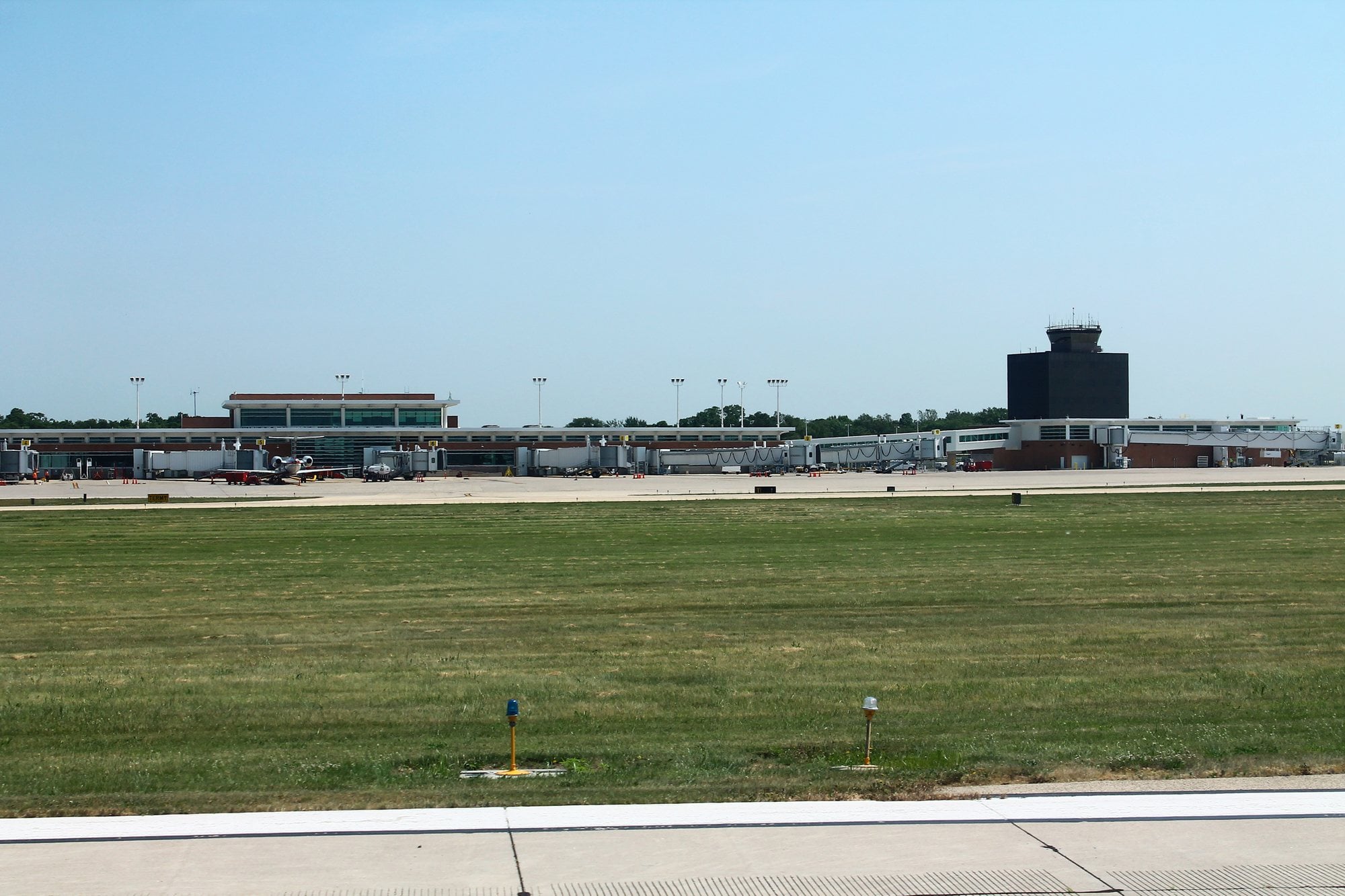 The terminal, jet bridges and control tower at General Wayne A. Downing Peoria International Airport seen across the airfield