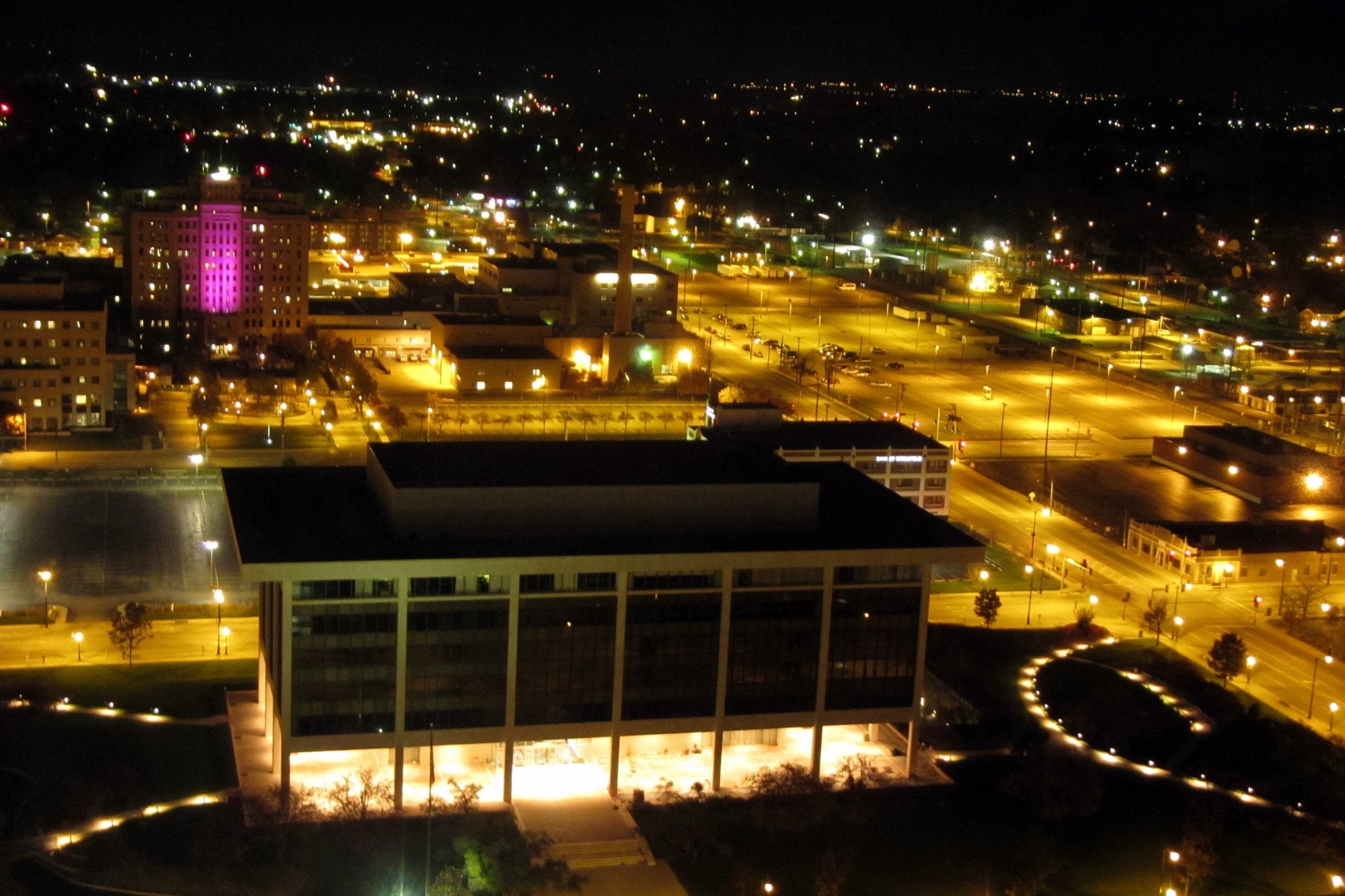 Night view from above of the Prairie Capital Convention Center, now the BOS Center, glowing in downtown Springfield.