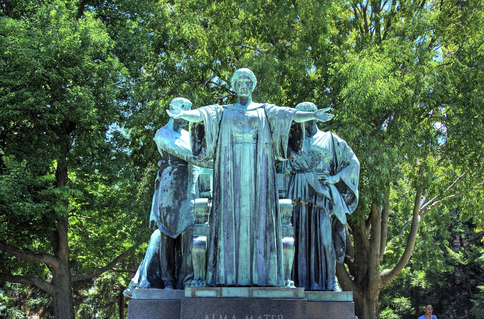 The bronze Alma Mater statue with arms outstretched on the University of Illinois campus.