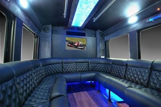 Lounge-style leather seating around the cabin of an Executive Transportation limousine coach